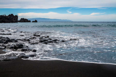 Playa la Arena black volcanic sand beach, Tenerife, Canary islands, Spainの写真素材