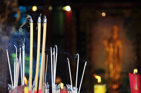 blessing and pray with joss stick in the chinese pagoda