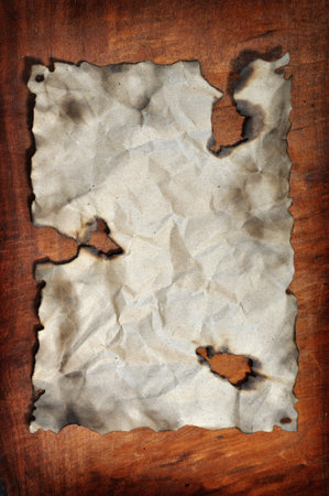 burned paper was placed on the wooden board for designs