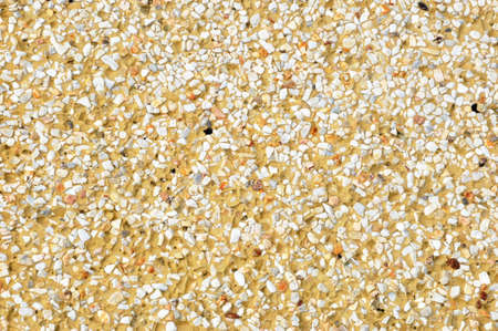 small rocks and fine stone in the yellow cementの写真素材