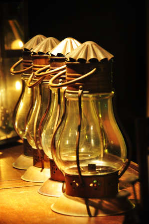 the old lanterns and candle light is shining from the darkの写真素材
