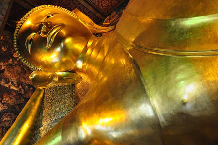 the golden lying buddha in Wat Pho, bangkok thailandの写真素材