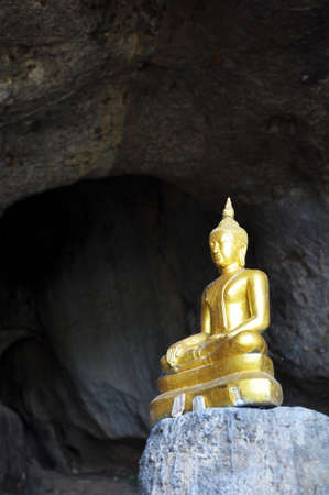 the old golden buddha in the cave - Kanchanaburi, thailandの写真素材
