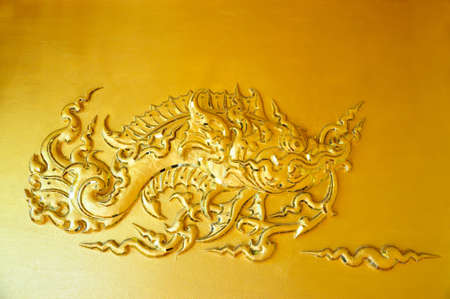the wall sculpture of the golden fishの写真素材
