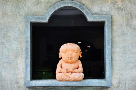 The crafted buddha statue made from clayの写真素材