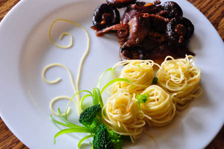 Pasta with chicken, shiitake mushroom, and broccoli の写真素材