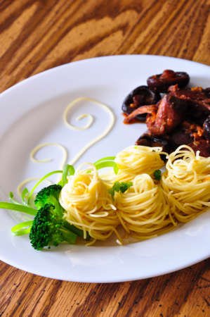 Pasta with chicken, shiitake mushroom, and broccoli の写真素材