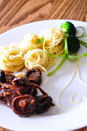 Pasta with chicken, shiitake mushroom, and broccoli の写真素材
