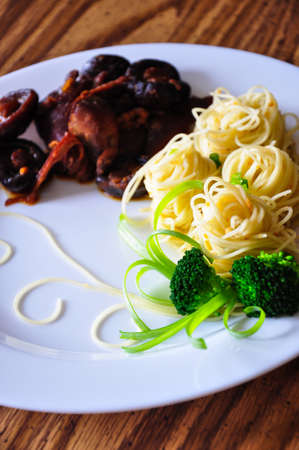 Pasta with chicken, shiitake mushroom, and broccoli の写真素材