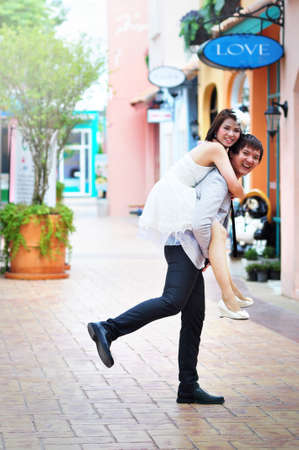 Young couple riding backの写真素材