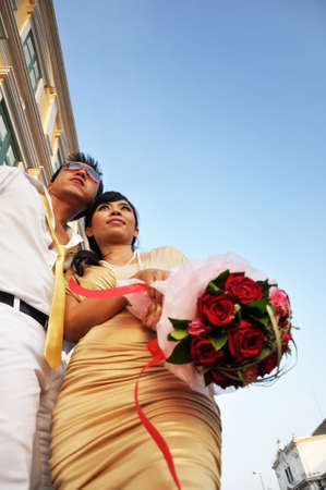A couple romantically stand in a cityの写真素材
