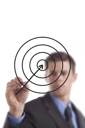 Young business man draws and points to a target. の写真素材