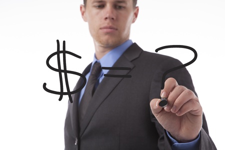 Young business man draws a dollar sign and a question mark. の写真素材