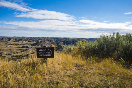 Warning Sign with a view over the Badlands in North Dakota