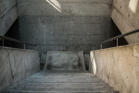 Urban grunge concrete stairway out of cement with stairs into the underground architecture.の写真素材