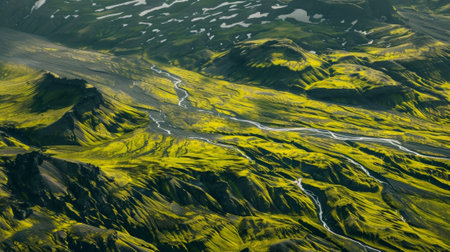 A patchwork of green meadows and rugged moraines showcasing the diverse landscape of a glacial regioの素材