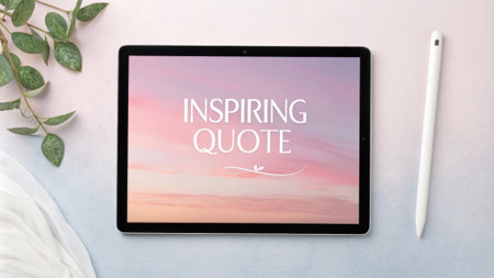 Inspiring quote displayed on tablet screen with pen and plantsの素材