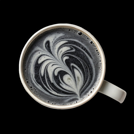 Charcoal latte showing artistic latte art on transparent backgroundの素材