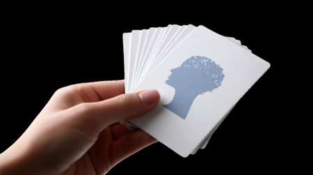 Hand holding grounding cards for anxiety relief with transparent backgroundの素材