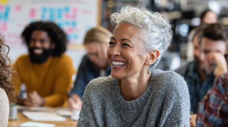 Medium shot of employees engaged in an interactive bias training workshop promoting awareness and empathy in the workplace for a diverse team.の素材