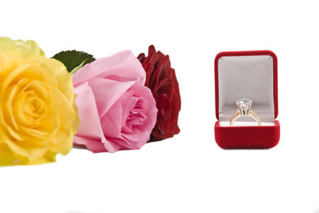 Roses and ring on a white background