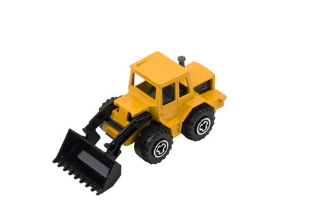 Compact wheel loader toy isolated on white background