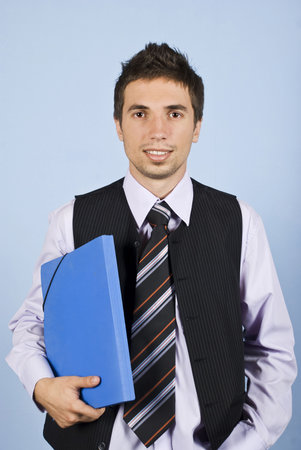 Young business man formal wear standing and holding a blue folder
