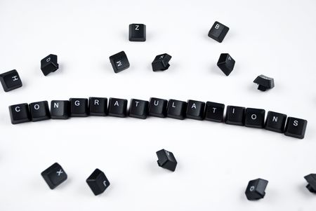 Congratulations word composed with black keyboard of computer keyboard in the middle of other lettersの写真素材
