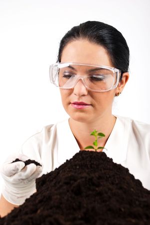 Agricultural scientist woman check soil and smile in a laboratoryの写真素材