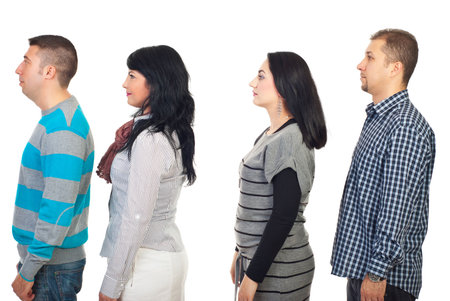 Four people standing in profile and looking away isolated on white background