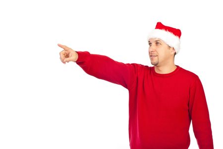 Handsome Santa helper man in red pullover pointing away to copy space isolated on white backgroundの写真素材
