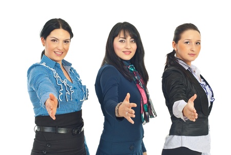 Business women in a row giving their hands to welcome in business isolated on white backgroundの写真素材