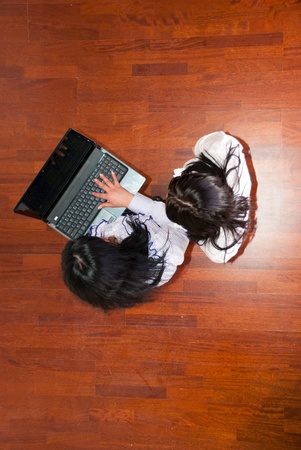 Top view of two business women using a laptop  in a office roomの写真素材