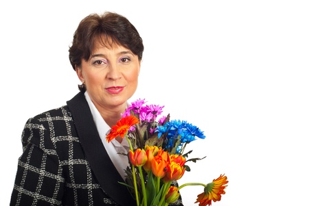 Mature woman holding fresh flowers isolated on white backgroundの写真素材