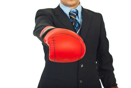 Close up of business man showing hand in boxing glove,selective focus on gloveの写真素材