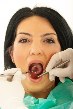 Close up of patient woman at dentist against white backgroundの写真素材
