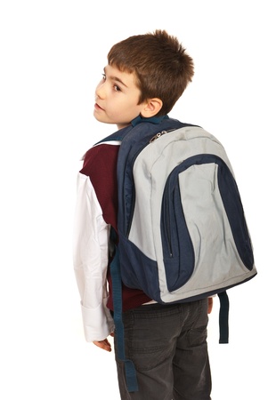 Student boy with  bag looking back over shoulder  isolated on white backgroundの写真素材