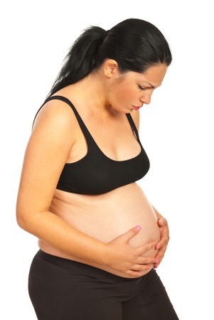 Pregnant woman having bad stomach ache isolated on white backgroundの写真素材