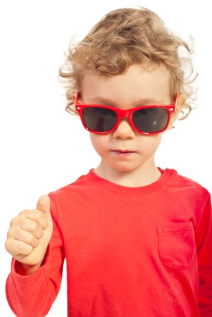 Modern toddler boy giving thumb up,selective focus on hand isolated on white backgroundの写真素材