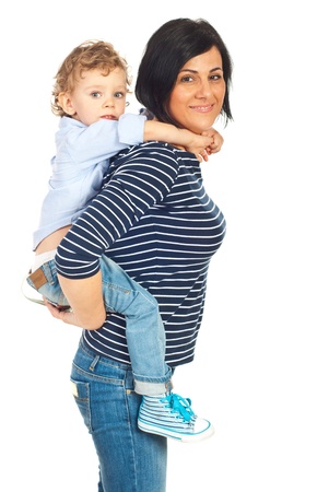 Smiling mother and son in piggy back isolated on white backgroundの写真素材