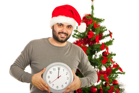 Man showing clock with midnight time for Christmas