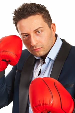 Business man with boxing gloves defending isolated on white の写真素材