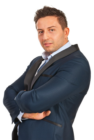 Confident business man with hands crossed isolated on white backgroundの写真素材