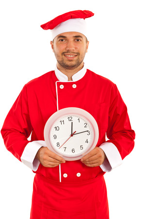 Cheerful chef with clock isolated on white backgroundの写真素材
