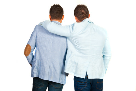 Back of business man friends standing in embrace isolated on white backgroundの写真素材