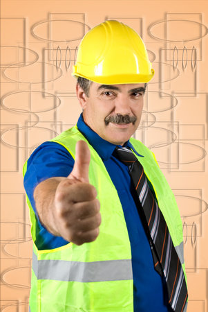 Attractive mature engineer man with hard hat giving thumbs -up  isolated on white backgroundの写真素材