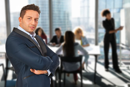Confident business man with hands crossed isolated on white background