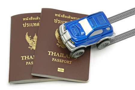 Thailand passport and blue 4wd car for travel concept.の写真素材