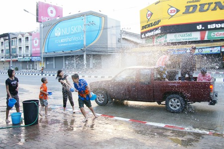 CHIANGMAI, THAILAND - APRIL 15, 2012 : People in a Songkran water fight festival. Songkran is a joyful summer festival which everybody can splash water to them for cool down from hot weather.のeditorial素材