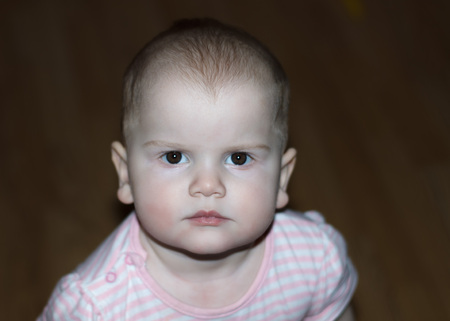 Smart little child with a serious lookの写真素材